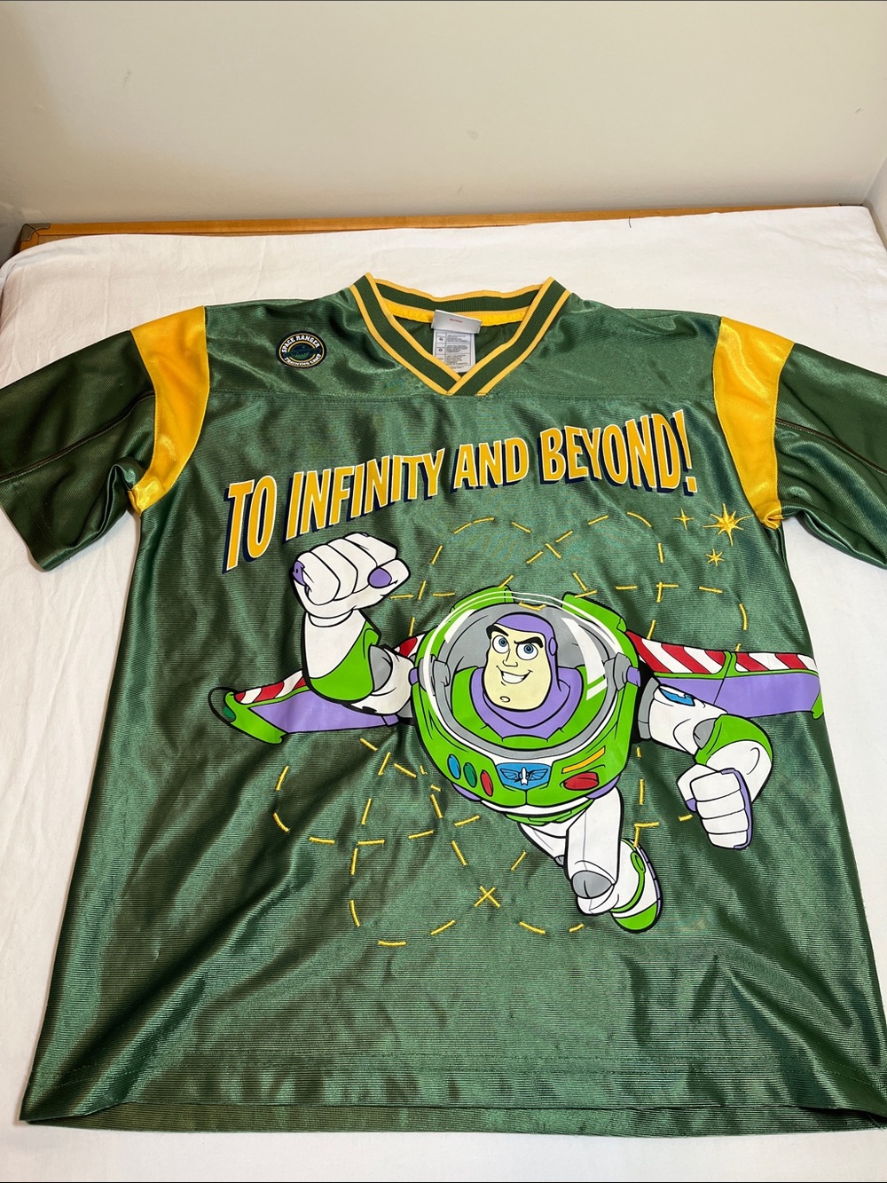Disney Buzz Lightyear Green and Yellow Retro Sport Jersey, size large (10/12)